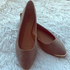Taupe Flats with metallic gold detail.